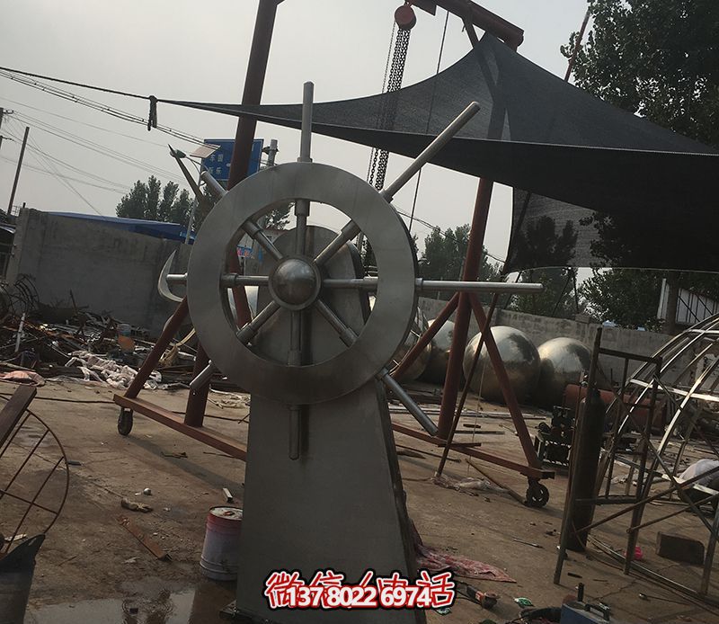 騰飛不銹鋼雕塑船舵，點綴室內(nèi)飯店